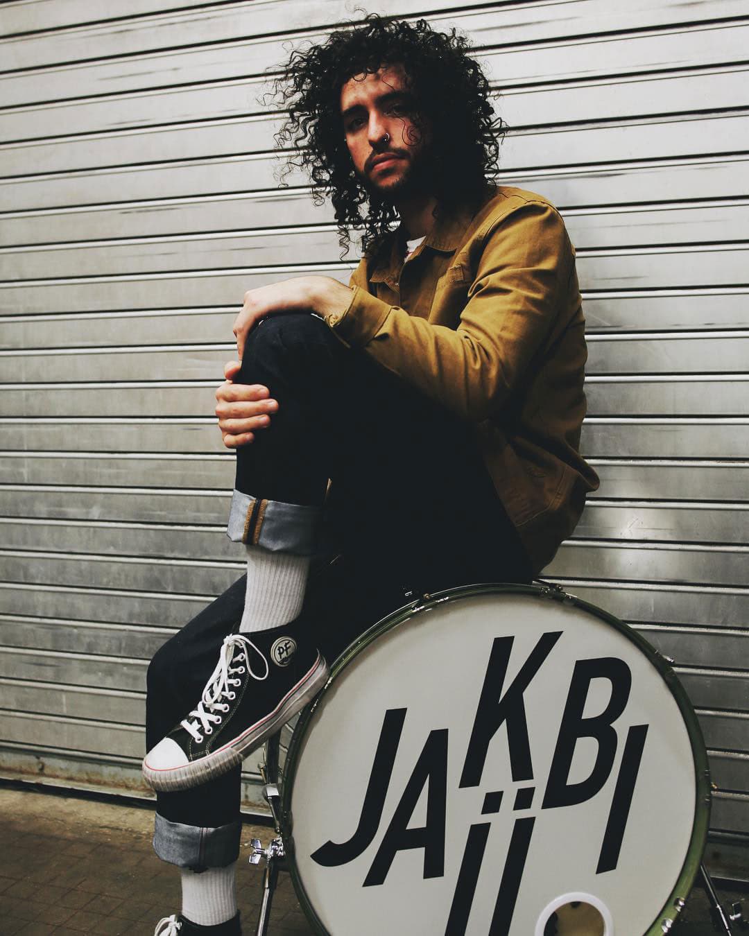 Jesse sitting on kick drum